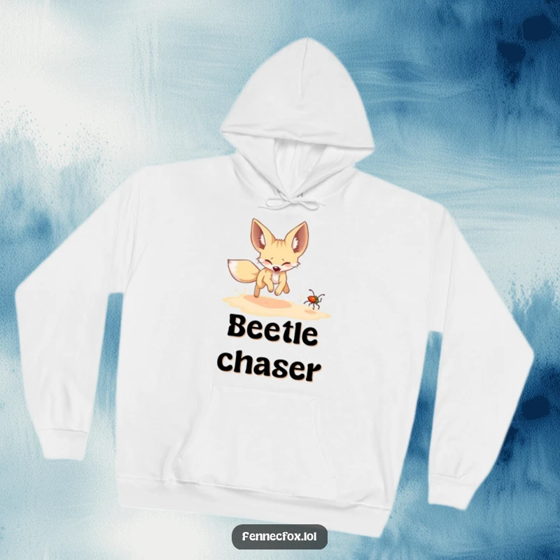 Funny Fennec Fox Hoodie: A fennec fox humorously chases a shimmering beetle, a funny depiction of energetic pursuit and delight.
