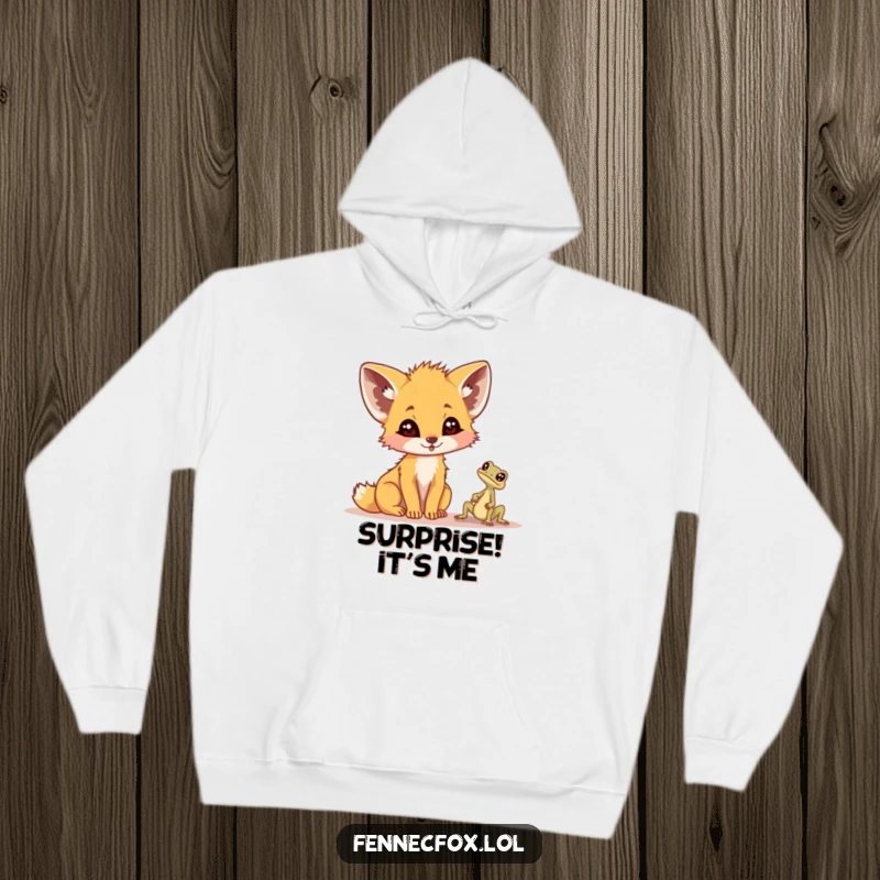 Funny fennec fox hoodie, cozy and warm, looking utterly surprised by a very small desert lizard at its feet, cute and comical.