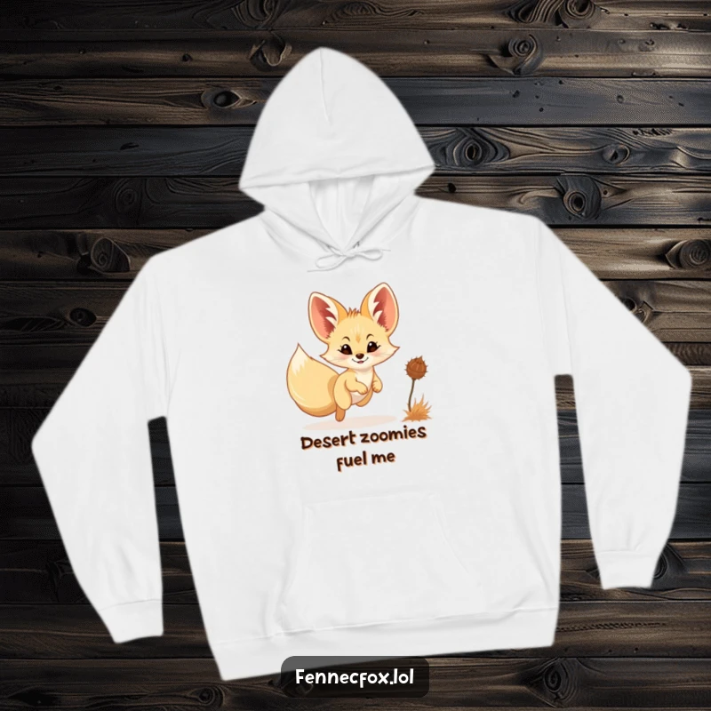 Funny Fennec Fox Hoodie: A charming fennec fox, smiling gently, playfully chases a tumbling tumbleweed under a desert sky.