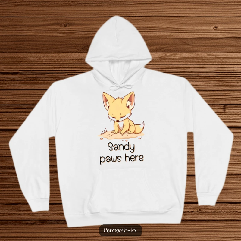 Funny hoodie depicting a cute fennec fox with big ears playfully digging in the sand with a focused expression, designed for comfort.
