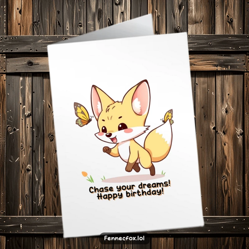 Funny Free Printable Birthday Card: Fennec fox excitedly chasing a fluttering butterfly, depicted with pure joy and motion.
