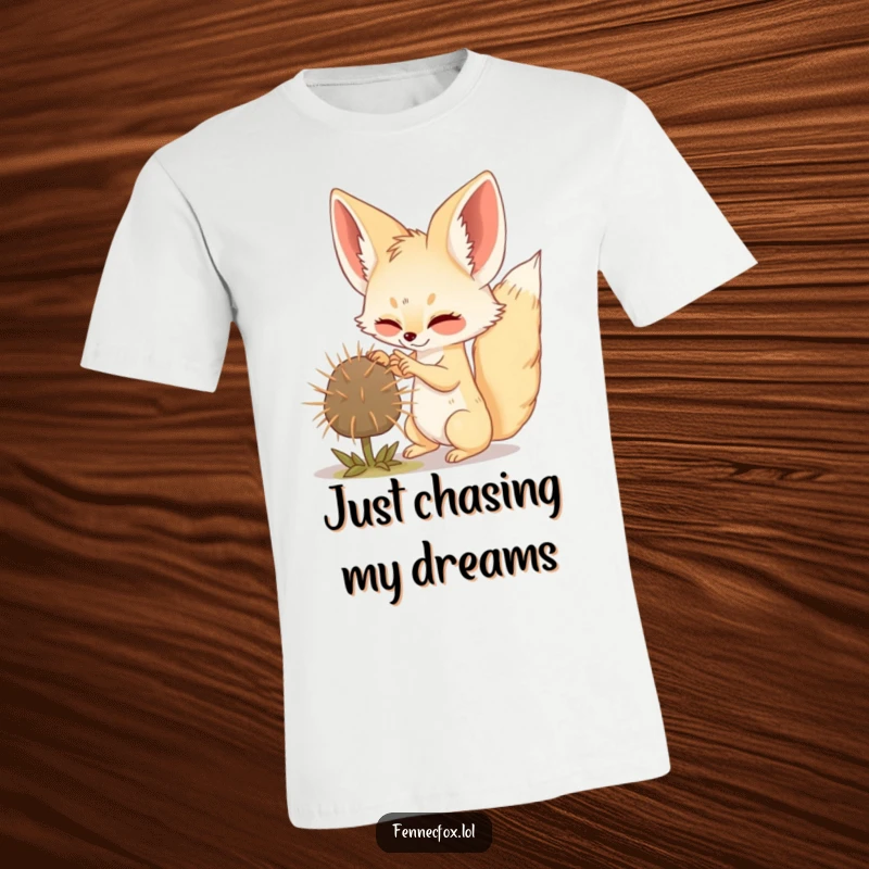 Funny Fennec Fox t-shirt showing a cute fox gleefully swatting a tumbleweed in a sandy desert.