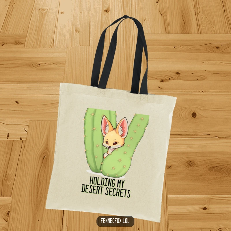 Funny fennec fox peeking from behind a spiky cactus on a tote bag, desert cute, humorous accessory.