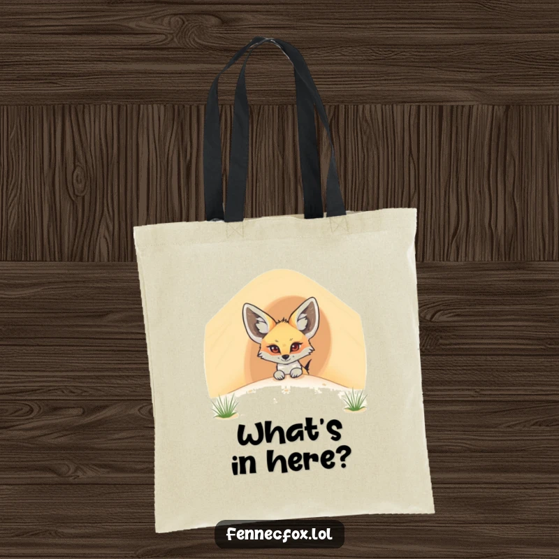 Funny fennec fox tote bag featuring a cartoon desert fox peeking out from behind a large sand dune, a playful surprise.